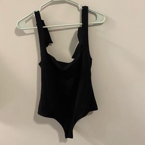 Free people thong body suit with tie detailed straps and open back
